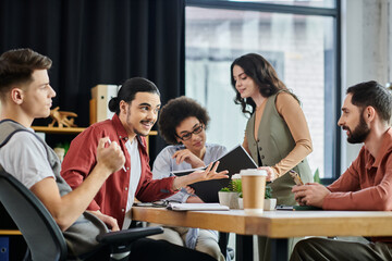 Professionals in stylish attire discuss sensitive topics while seated at a conference table.