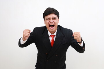 Angry crazy tired bad tempered young office manager or business man feeling pissed off loses control and yells in tantrum venting negative emotions isolated on white background