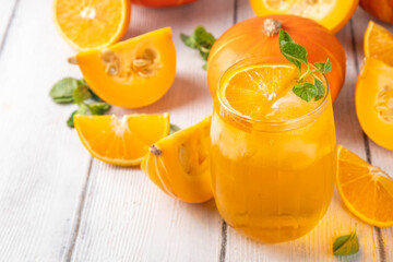 Pumpkin and orange autumn lemonade drink. Sweet tasty drink for fall Thanksgiving party, tasty fruit punch or margarita cocktail