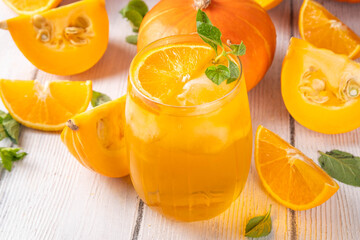 Pumpkin and orange autumn lemonade drink. Sweet tasty drink for fall Thanksgiving party, tasty fruit punch or margarita cocktail