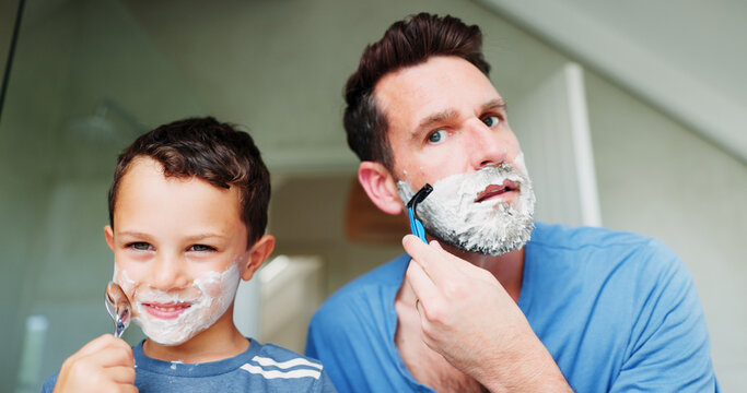 Shaving cream, bathroom and dad with boy for skincare, happy and playful practice for growth or development. Father, family and together in home for learning facial, grooming and bonding with love.