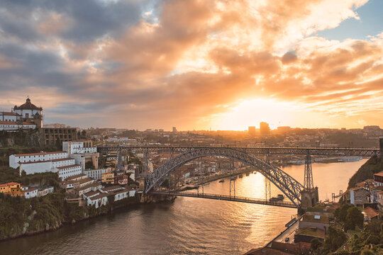 Cloudy sunset view of Dom Luiz bridge, Porto, Portugal