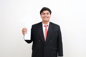 Young happy Asian businessman holding up arrow isolated on white background