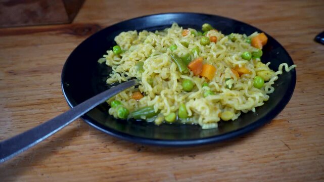 A mixed vegetable Maggi noodle platter served at a roadside Indian cafe, a popular snack meal throughout India.