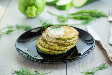 zucchini fried in batter with sauce