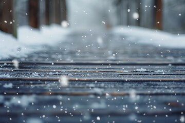 Soft snowflakes gently fall on a wooden path creating a winter wonderland, evoking feelings of serenity and magic.