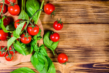Heap of small cherry tomatoes on wooden table. Top view