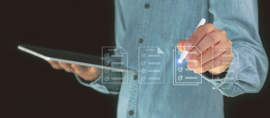 Fototapeta premium Concept of electronically checking smart items and documents on a virtual screen. Businessman checks electronic documents Borderless communication technology