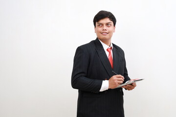 Young Asian businessman entrepreneur standing while holding digital tablet. Businessman leader, professional company manager using smart corporate management technology looking at copyspace