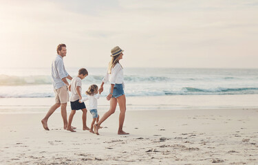 Fototapeta premium Family, beach and holding hands on vacation with travel, love and care together by the sea. Happy, parents and kids in Miami walking by ocean outdoor on holiday with wellness, trust and security
