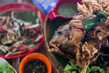 Crispy tilapia fish cooked with herbs, lemongrass, kaffir and lime leaves. Thai food