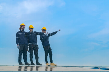 Worker Technicians are working to construct solar panels system on roof. Installing solar photovoltaic panel system. Men technicians walking on roof structure to check photovoltaic solar modules.