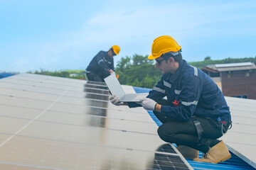 engineer man inspects construction of solar cell panel or photovoltaic cell by electronic device....
