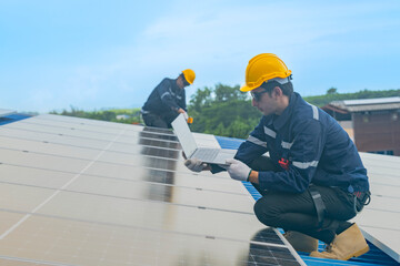 engineer man inspects construction of solar cell panel or photovoltaic cell by electronic device....