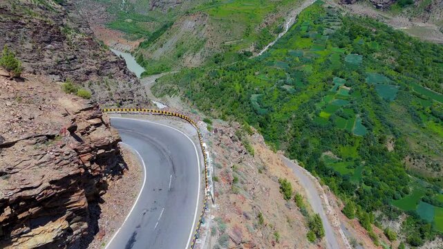 clean and road with Chenab River in Asia, view of himachal in mountains from Drone