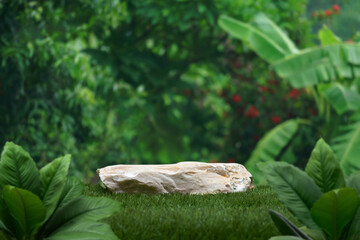 Stone podium tabletop floor in outdoors tropical garden forest blurred green leaf plant nature background.Natural product placement pedestal stand display,jungle paradise concept.