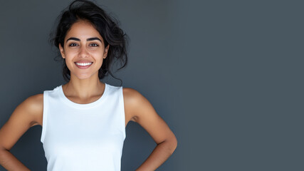 Obraz premium Arabian woman smile hands on hips wearing white t-shirt isolated on gray