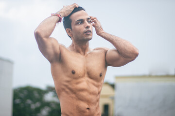 A fitness Indian male model sweating after an intense workout