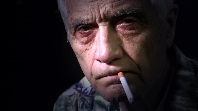 Close up old man with cigarette