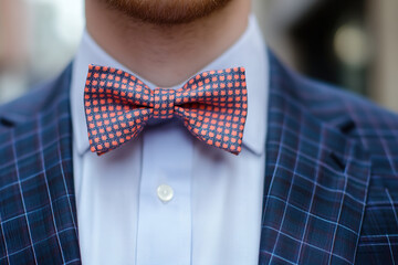 Man adjusting bow tie. Fathers Day Holiday. Bow Tie Day on 28th August