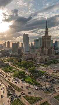 Warsaw Poland time lapse high angle view sunset city skyline at Centrum Square downtown business district (Vertical)