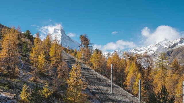 Zermatt Switzerland time lapse of Matterhorn mountain peak and Gornergrat bahn train in Autumn Season