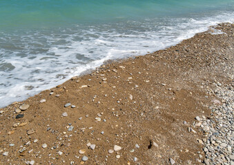 Close up view of a beautiful beach filled with colorful sea stones, perfect for use as a wallpaper or detailed background image.