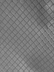 Cloth abstract pattern close view, textile abstract background. Black and white monochrome grayscale photo