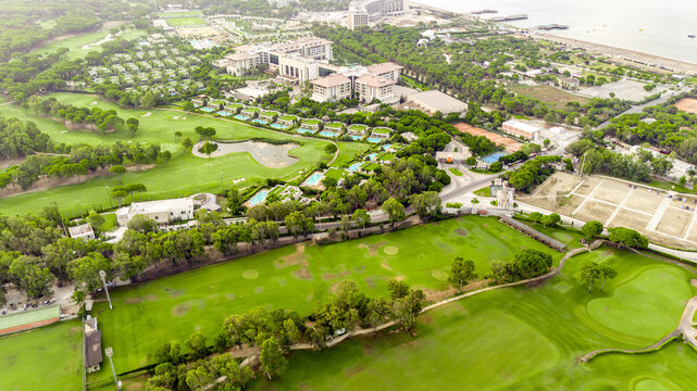 Aerial view of golf course and luxury villas in Belek, Turkey. Scenic panoramic view of golf fairway
