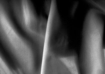 Deep blue glossy cloth texture background. Natural textile material photo, pattern cover. Black and white monochrome grayscale photo