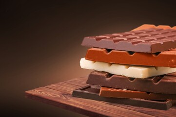 Tasty sweet dark chocolate bar on the desk