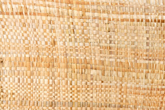 Weavered bast cloth on manual loom. Top view.