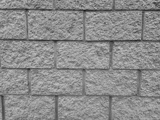 Old brick wall pattern close view background, stone texture surface. Black and white monochrome grayscale photo