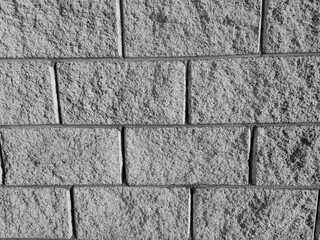 Old brick wall pattern close view background, stone texture surface. Black and white monochrome grayscale photo