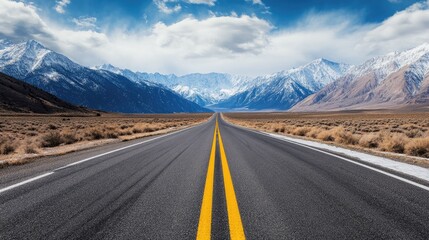 Naklejka premium Long, straight road through snow mountains under a dramatic sky, capturing the essence of adventure.