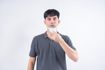 Portrait of handsome Asian man wearing face mask for protection against pollution and disease....