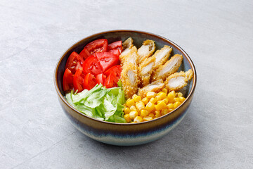 Crispy breaded chicken poke bowl on a gray background for a food delivery site