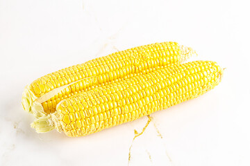 Sweet yellow raw corn cob
