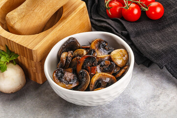 Roasted champignon mushrooms in the bowl