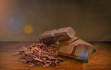Tasty sweet dark chocolate bar on the desk