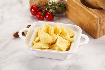 Crushed parmesan cheese in the bowl