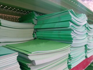 A stack of notebooks in a supermarket window. Buying notebooks for school. Preparing for school....