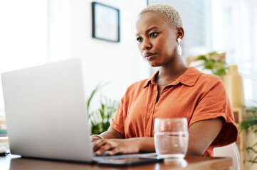 Typing, online and black woman with laptop, office and thinking of ideas and copywriting. Writer,...
