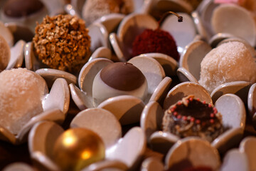 close up of chocolate candies, sweets background, assorted sweets, sweets table, brigadeiro, party sweets, seen from above, top view, fine sweets, party sweets, background