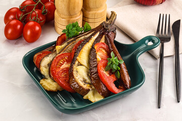 Baked tomato with mozzarella and tomato