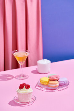 Still life with fresh muffins and soda glasses on the table in room
