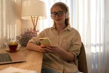 Girl answering text message on smartphone