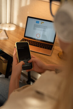 Girl typing and sending text message to friend