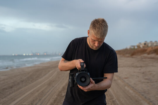 Thoughtful videographer recording video