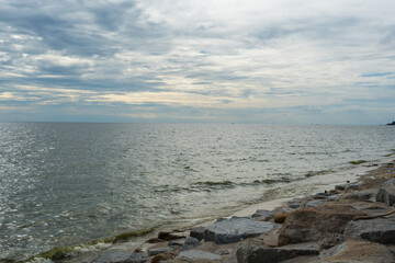 Beach with rocky and clear water at Bang Saen Beach, Chonburi, Thailand